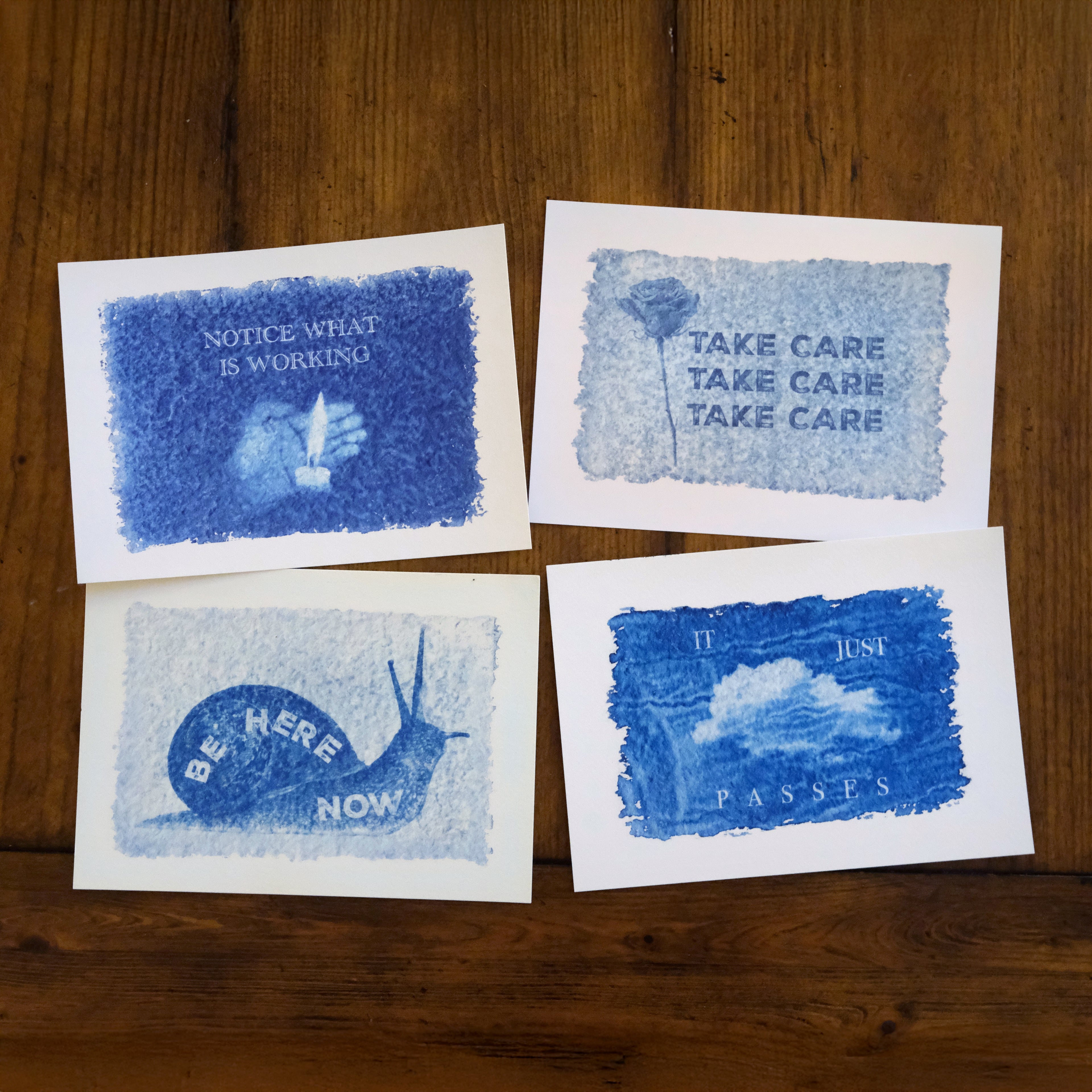 Product photos of Mantra Mail Club, including four photos of past prints. 